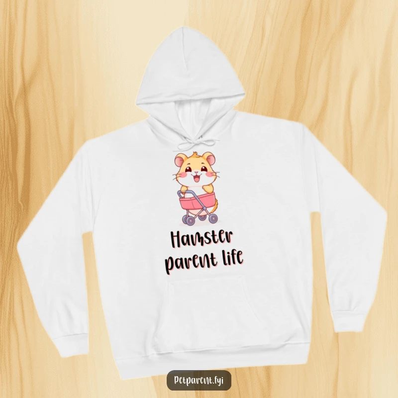 Funny Hamster Hoodie: A joyful hamster pushes a miniature stroller. Humorous and cozy design.