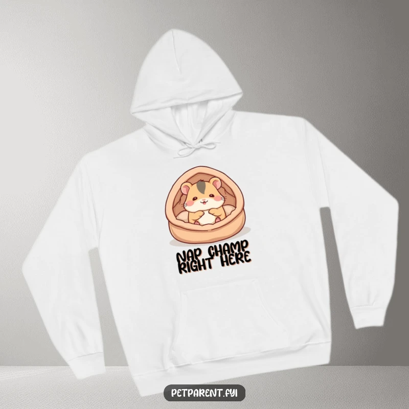 Funny hamster hoodie featuring a cute hamster character building a plush and cozy bed, offering warmth and a touch of humor.