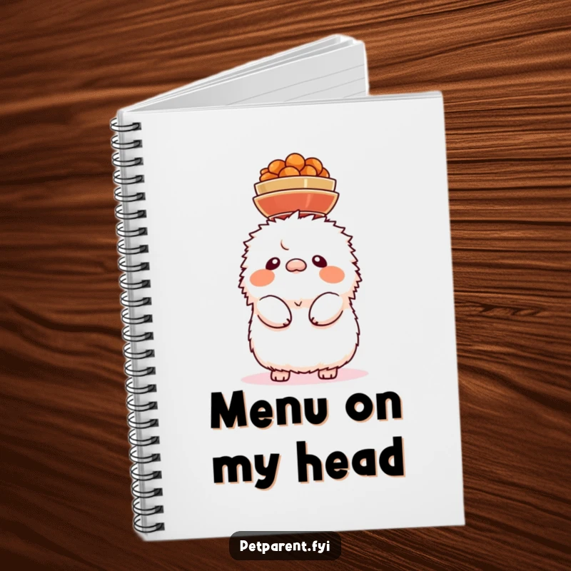 Funny notebook cover with a fluffy creature precariously balancing food bowls on its head, a symbol of comic struggle.