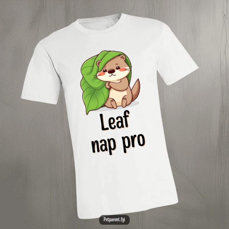 Funny t-shirt featuring a whimsical otter using a large leaf as a cozy blanket, illustrating a charming and humorous outdoor scene.